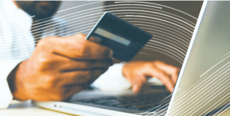 Man using credit card for online transaction