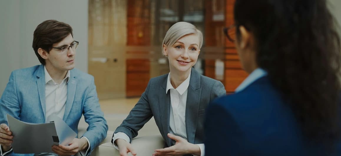 Illustration comparing U.S. credit union business checking options with fees, item allowances, ACH tools, and membership icons.