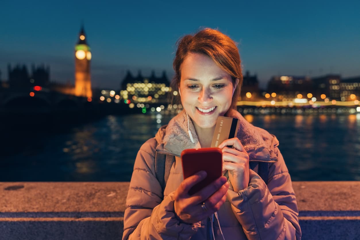Expat using her credit card in London, England in the United Kingdom