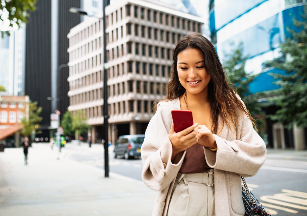 Young woman in England receiving a money transfer