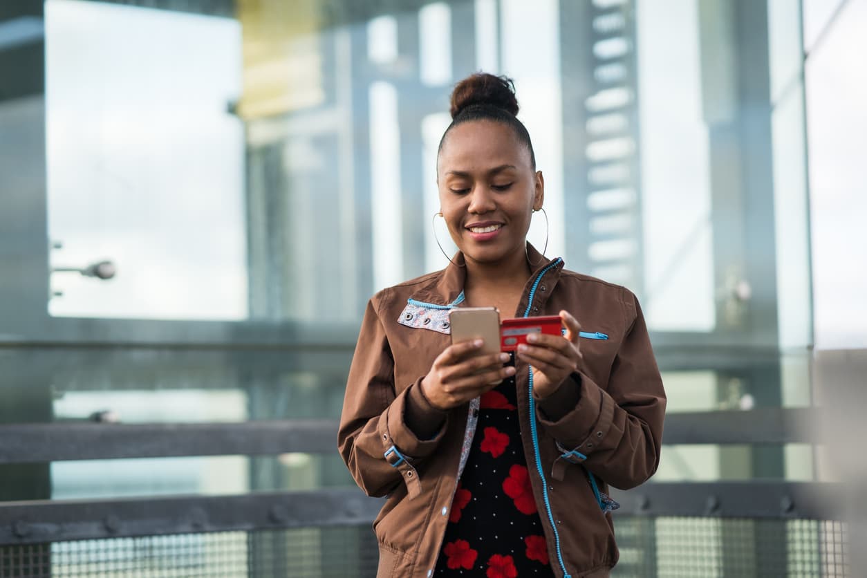 Young woman in Auckland, New Zealand using her credit card